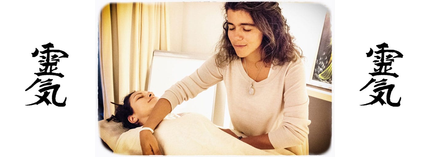 What is Reiki? Reiki master Hande Ozerden is seen channeling healing energy to a client during a session.