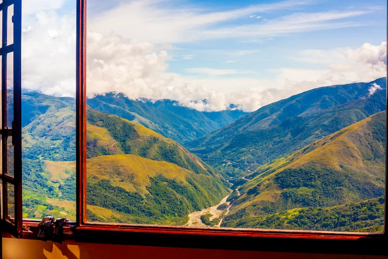 A mountain view through a window, a symbol of sending distance Reiki to the past and the future.